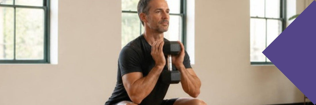 A triathlete over 40 doing a goblet squat in a bright training studio