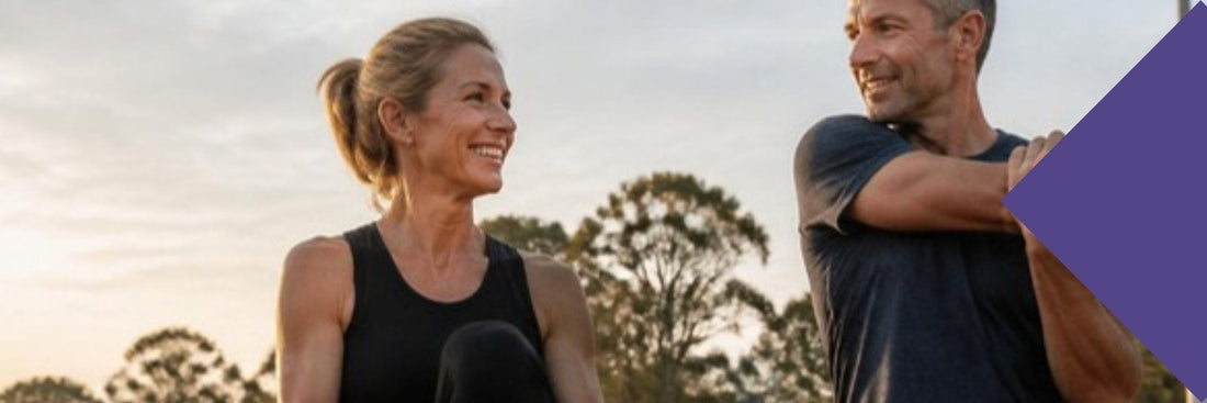 Supplements for masters athletes: two masters athletes stretching on a track at sunrise