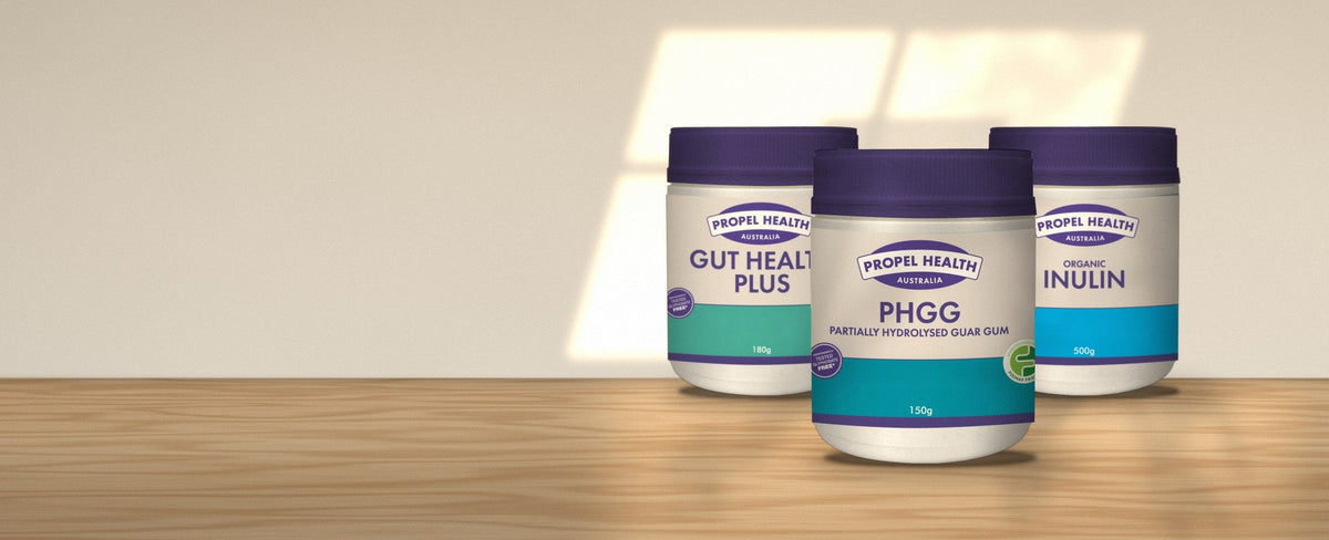 Propel Health Australia PHGG, Gut Health Plus and Organic Inulin jars on an oak bench in morning light